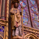 View of stained glass windows and statuary in Sainte-Chapelle in Paris.