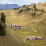 A farm tucked into the Swiss Alps.