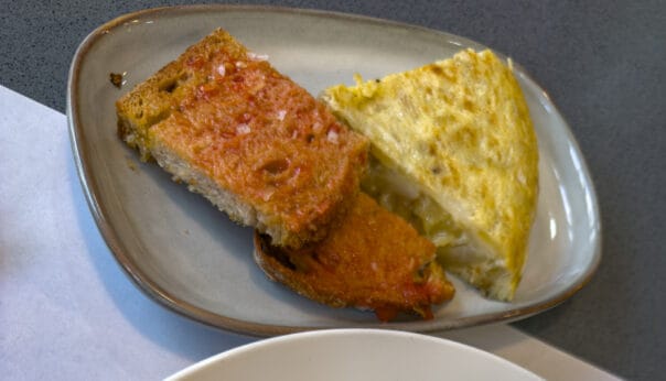 Rub fresh tomato directly onto bread.